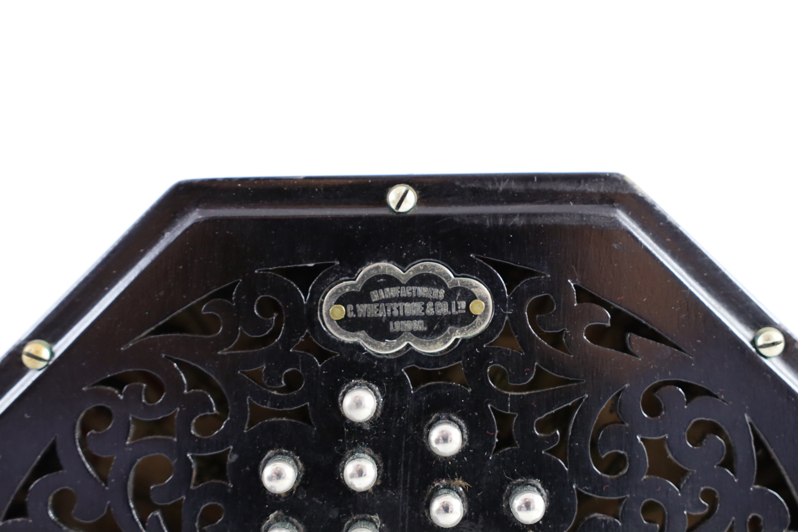 PLEASE NOTE 57 KEYS. A Wheatstone 'English' Model No. 5E 57 key concertina, diameter 17cm, with original leather case